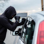 bigstock-car-thief-trying-to-break-into-129418745