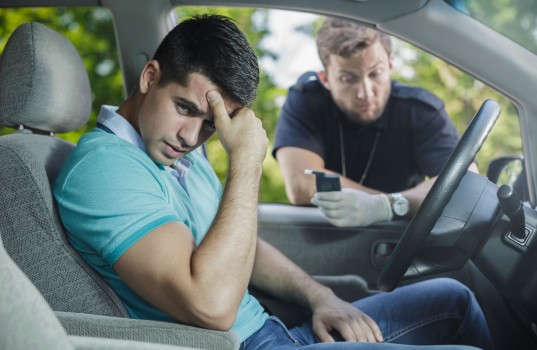 49423463 - worried young driver caught on driving after alcohol