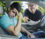 49423463 - worried young driver caught on driving after alcohol