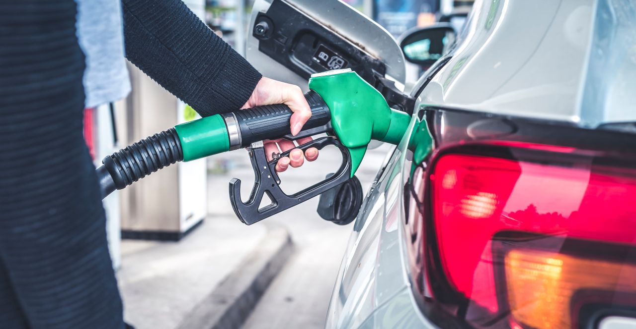 Woman,Pumping,Gasoline,Fuel,In,Car,At,Gas,Station.