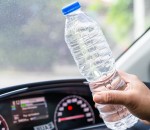 Asian,Woman,Driver,Holding,Bottle,For,Drink,Water,While,Driving